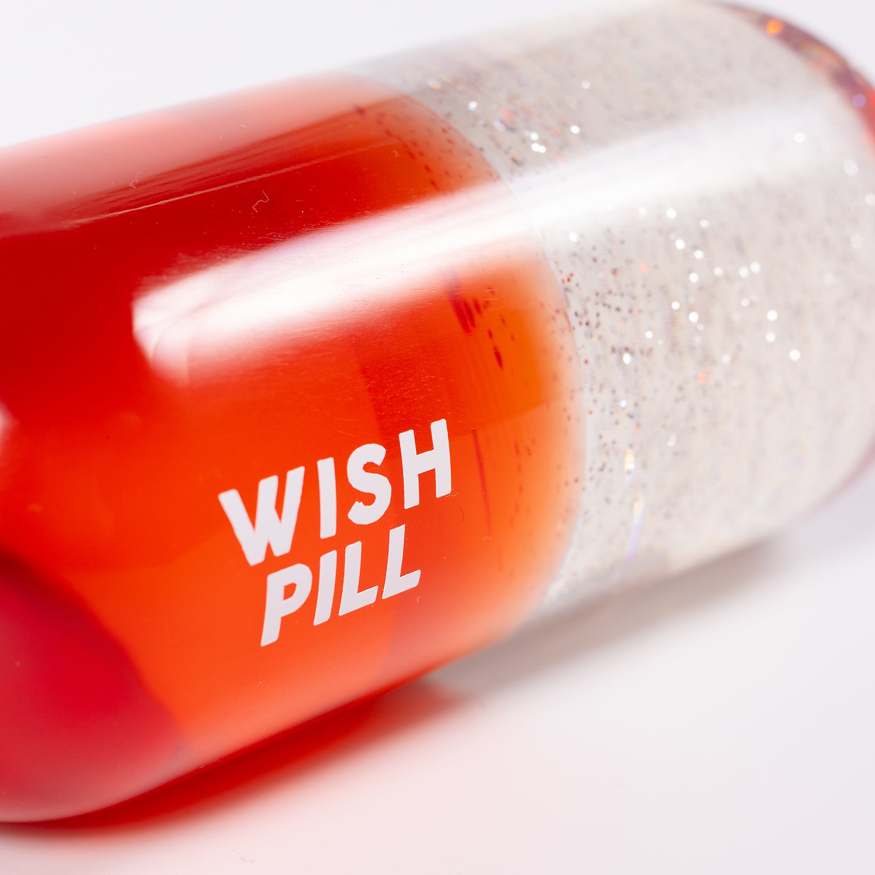 escultura glitter pill - wish